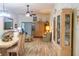 Open living room and dining area with light wood flooring at 15 Winterset Dr, Winter Haven, FL 33884