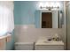 Clean bathroom with light blue walls and updated vanity at 15 Winterset Dr, Winter Haven, FL 33884