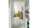 Bright hallway with access to bedroom and storage at 15 Winterset Dr, Winter Haven, FL 33884