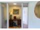 Light and bright entryway with built-in desk and wood flooring at 15 Winterset Dr, Winter Haven, FL 33884