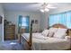 Spacious bedroom with large bed, dresser, and window at 15 Winterset Dr, Winter Haven, FL 33884