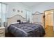 Main bedroom with a large bed and a built-in wardrobe at 169 Violet Ct, Kissimmee, FL 34759
