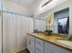 Double vanity bathroom with granite countertops at 169 Violet Ct, Kissimmee, FL 34759