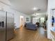 Open living area featuring hardwood floors and ample natural light at 169 Violet Ct, Kissimmee, FL 34759