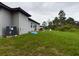Spacious backyard with grassy area, providing ample space for outdoor activities at 169 Violet Ct, Kissimmee, FL 34759