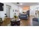 Open concept living room with hardwood floors and a view of the kitchen at 169 Violet Ct, Kissimmee, FL 34759