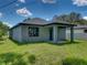 House showcasing backyard and neighborhood view at 213 Cordova Rd, Auburndale, FL 33823