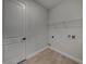 Bright laundry room with ample shelving at 213 Cordova Rd, Auburndale, FL 33823