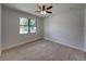 Spacious bedroom with ceiling fan and large window at 213 Cordova Rd, Auburndale, FL 33823