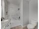 Modern bathroom with a white bathtub and granite countertop at 213 Cordova Rd, Auburndale, FL 33823