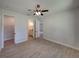 Bedroom with ceiling fan and en-suite bathroom access at 213 Cordova Rd, Auburndale, FL 33823