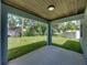 Covered patio overlooking spacious backyard at 213 Cordova Rd, Auburndale, FL 33823
