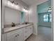 Modern bathroom with double vanity and granite countertop at 213 Cordova Rd, Auburndale, FL 33823
