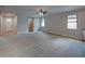 Open concept living area with wood-look tile floors at 213 Cordova Rd, Auburndale, FL 33823