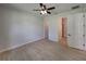 Spacious bedroom with ceiling fan and walk-in closet at 213 Cordova Rd, Auburndale, FL 33823