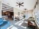 Bright sunroom with tiled floors, comfy seating, and access to backyard at 2505 Salzburg Loop, Winter Haven, FL 33884