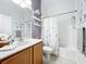 Clean bathroom with a bathtub, shower, and updated vanity at 2505 Salzburg Loop, Winter Haven, FL 33884