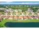 Aerial view of community, showcasing homes and water features at 2505 Salzburg Loop, Winter Haven, FL 33884