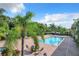 Relaxing pool area with patio furniture and palm trees at 2505 Salzburg Loop, Winter Haven, FL 33884