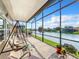 Enjoy lake views from this comfortable screened lanai with a swing at 2505 Salzburg Loop, Winter Haven, FL 33884