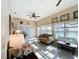 Relaxing sunroom with water views, comfortable seating and large windows at 2505 Salzburg Loop, Winter Haven, FL 33884