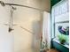 Walk-in shower with grab bars and tiled walls at 2505 Salzburg Loop, Winter Haven, FL 33884