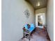 Covered entryway with a bench and tile floor at 2505 Salzburg Loop, Winter Haven, FL 33884