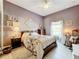 Bedroom with queen-size bed and rocking chair at 2505 Salzburg Loop, Winter Haven, FL 33884