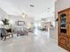Spacious living room with tiled floors, light walls, and comfortable seating at 2505 Salzburg Loop, Winter Haven, FL 33884