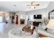 Living room with fireplace, large TV, comfortable seating, and ample natural light at 2505 Salzburg Loop, Winter Haven, FL 33884