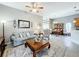 Open concept living room with a view into the dining area and kitchen at 2505 Salzburg Loop, Winter Haven, FL 33884
