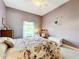 Spacious bedroom with ceiling fan and window at 2505 Salzburg Loop, Winter Haven, FL 33884