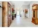 Spacious hallway with tile floors and antique furniture at 2505 Salzburg Loop, Winter Haven, FL 33884