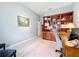 Bright home office with built-in wooden shelving and comfortable seating at 2505 Salzburg Loop, Winter Haven, FL 33884