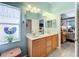 Double vanity bathroom with view of bedroom at 2505 Salzburg Loop, Winter Haven, FL 33884