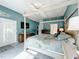 Serene bedroom with a large four-poster bed and access to the backyard at 2505 Salzburg Loop, Winter Haven, FL 33884