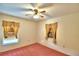 Well-lit bedroom with two windows and ceiling fan at 317 C St, Lake Wales, FL 33853