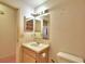 Bathroom with a sink, toilet, and medicine cabinet at 317 C St, Lake Wales, FL 33853