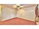 Simple bedroom with ceiling fan and carpeting at 317 C St, Lake Wales, FL 33853