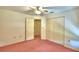 Bedroom with ceiling fan and double door closet at 317 C St, Lake Wales, FL 33853
