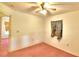 Bright bedroom featuring a ceiling fan and window with curtains at 317 C St, Lake Wales, FL 33853