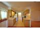 Functional kitchen with light wood cabinets, stainless steel appliances, and a breakfast bar at 317 C St, Lake Wales, FL 33853