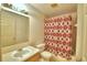 Bathroom with shower/tub combo, sink, and patterned shower curtain at 317 C St, Lake Wales, FL 33853