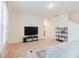 Spacious living room with neutral carpeting and large TV at 460 Boardwalk Ave, Haines City, FL 33844