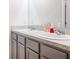 Bathroom with double vanity and gray cabinets at 460 Boardwalk Ave, Haines City, FL 33844