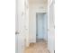 Bright hallway with light brown carpet and doors to other rooms at 460 Boardwalk Ave, Haines City, FL 33844
