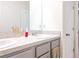 Bathroom with double vanity and gray cabinets at 460 Boardwalk Ave, Haines City, FL 33844