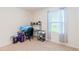 Bright home office space with a computer setup and ample natural light at 460 Boardwalk Ave, Haines City, FL 33844