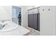 Bathroom with double vanity, shower, and walk-in closet at 460 Boardwalk Ave, Haines City, FL 33844