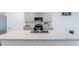 Kitchen island with sink and granite countertop at 460 Boardwalk Ave, Haines City, FL 33844